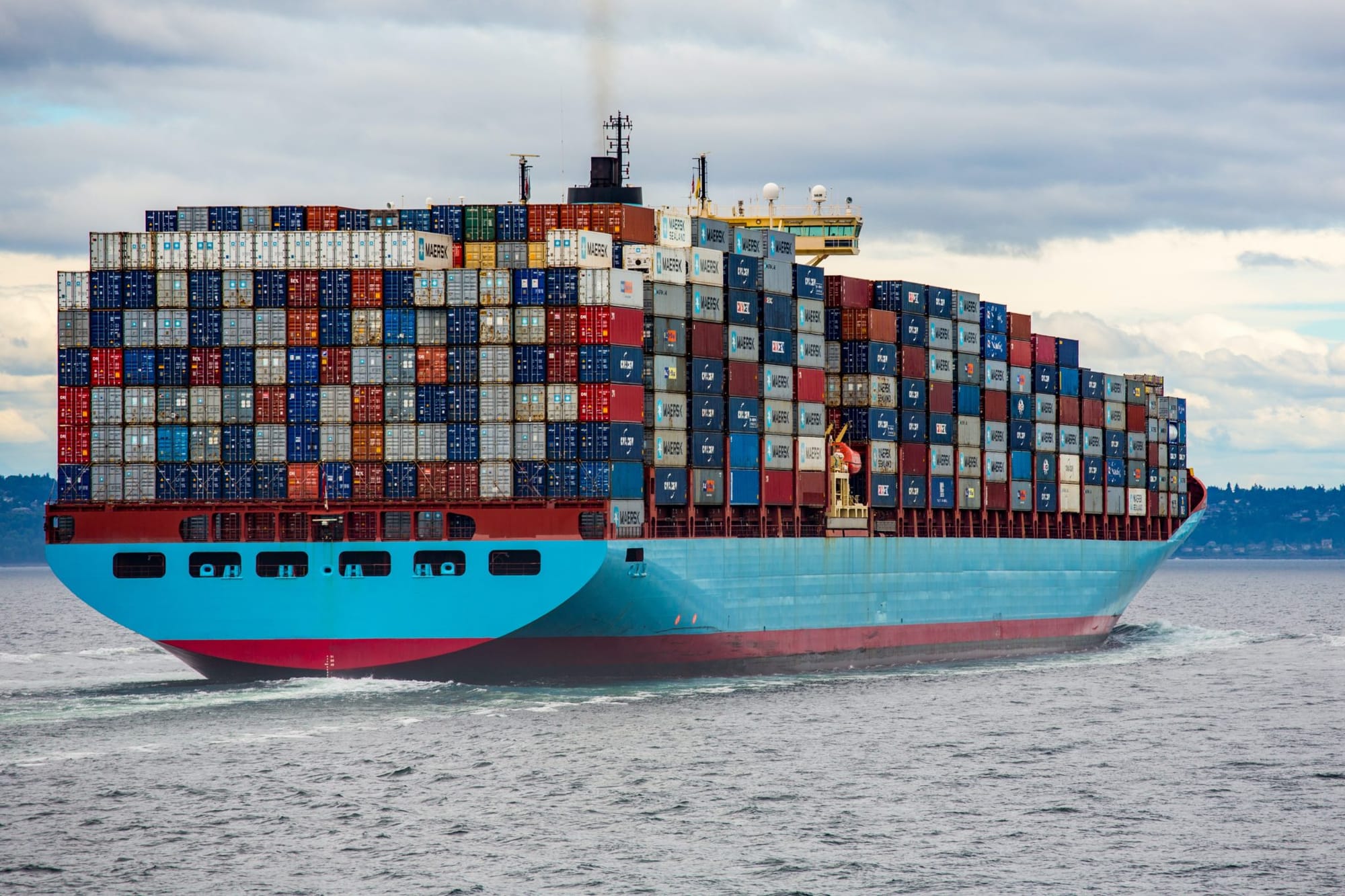 an image of a fully loaded container ship